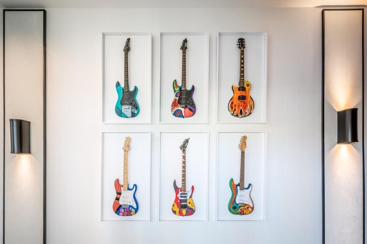 Barcelo Imagine Hotel Madrid Exterior photo The six signature guitars